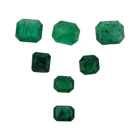 Six green faceted gemstones in varying sizes arranged on a plain white background.