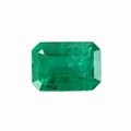 Rectangular green emerald gemstone on a white background