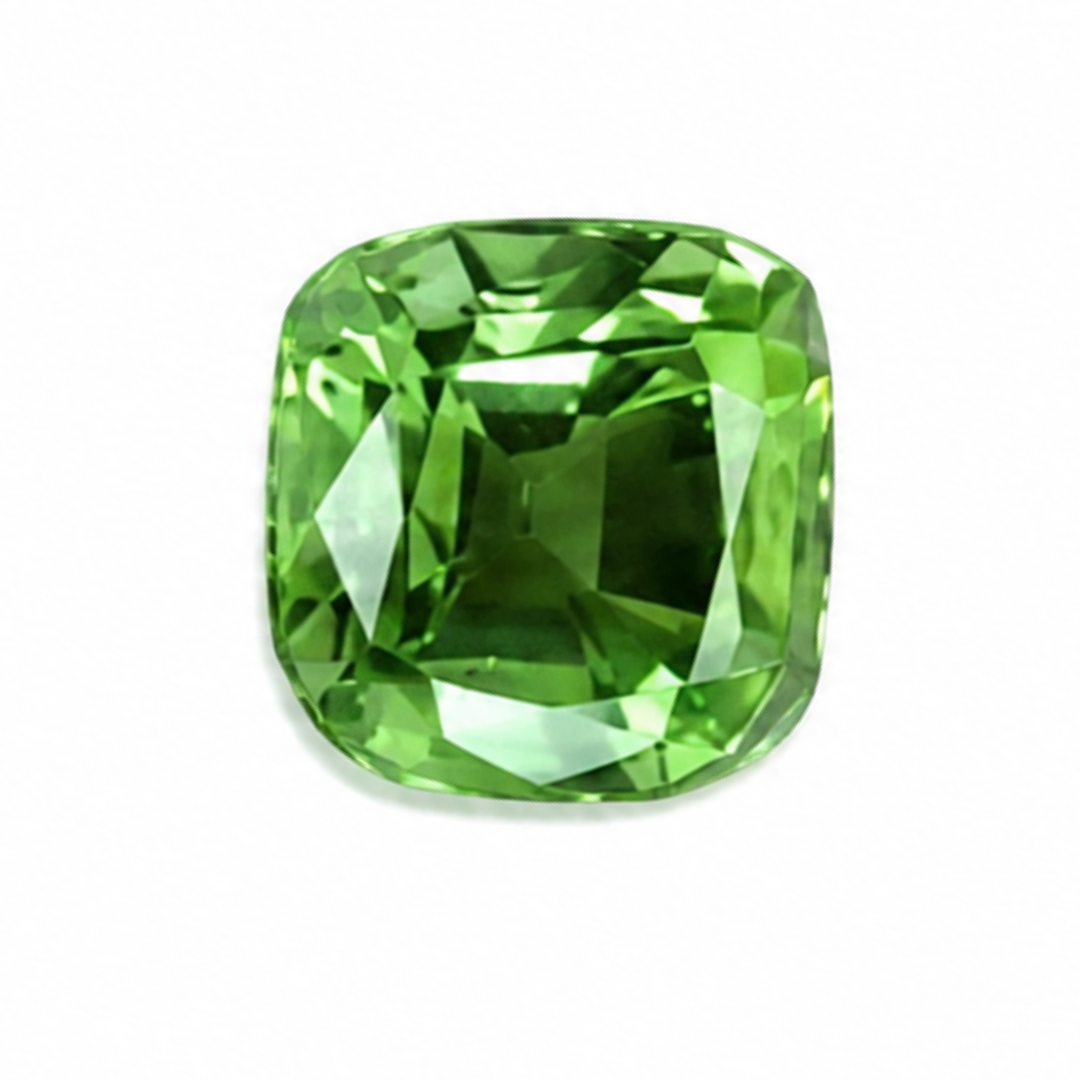 A cushion-cut green gemstone with a faceted, polished finish, centered on a plain white background.
