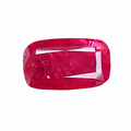 A single cushion-cut pinkish-red gemstone with a rounded rectangular shape and beveled edges, shown on a plain white background.