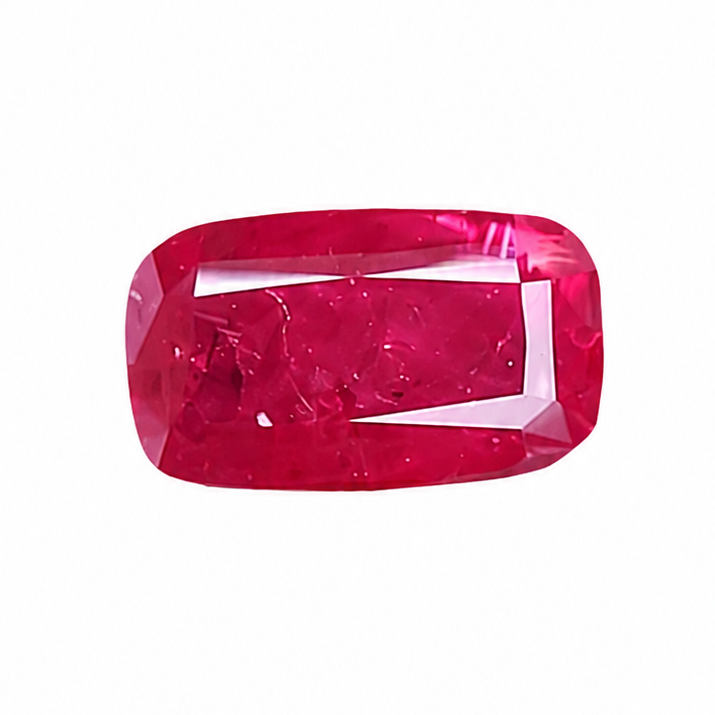 A single cushion-cut pinkish-red gemstone with a rounded rectangular shape and beveled edges, shown on a plain white background.